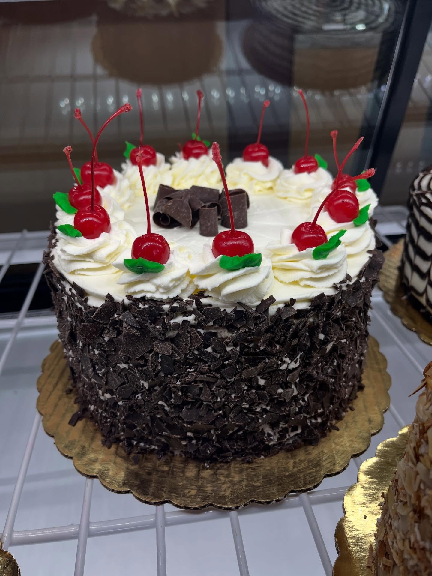 Black Forest cake with cherries and cream frosting